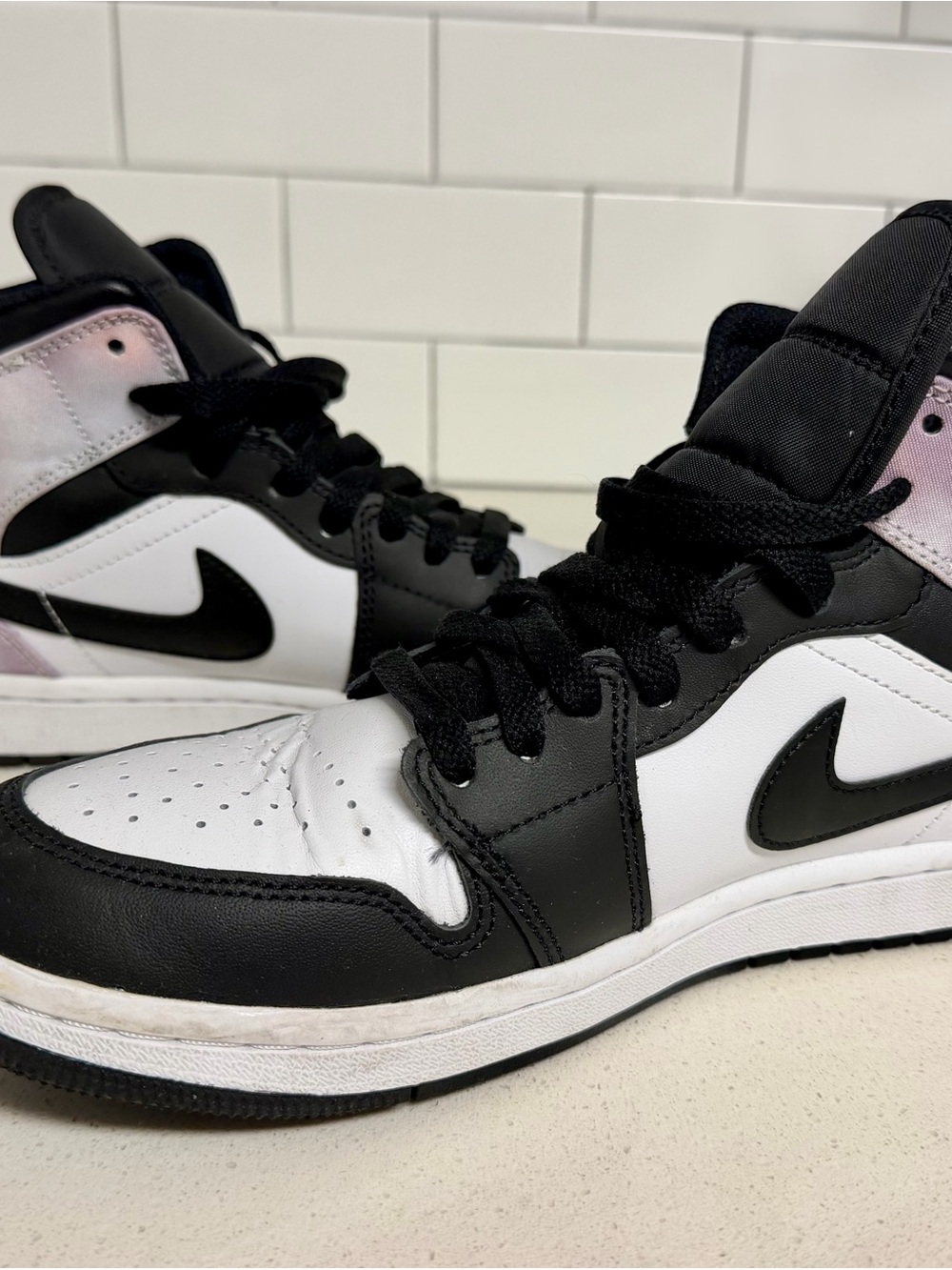 Jordan Women's Black and White High-Top Sneakers with Iridescent Heel